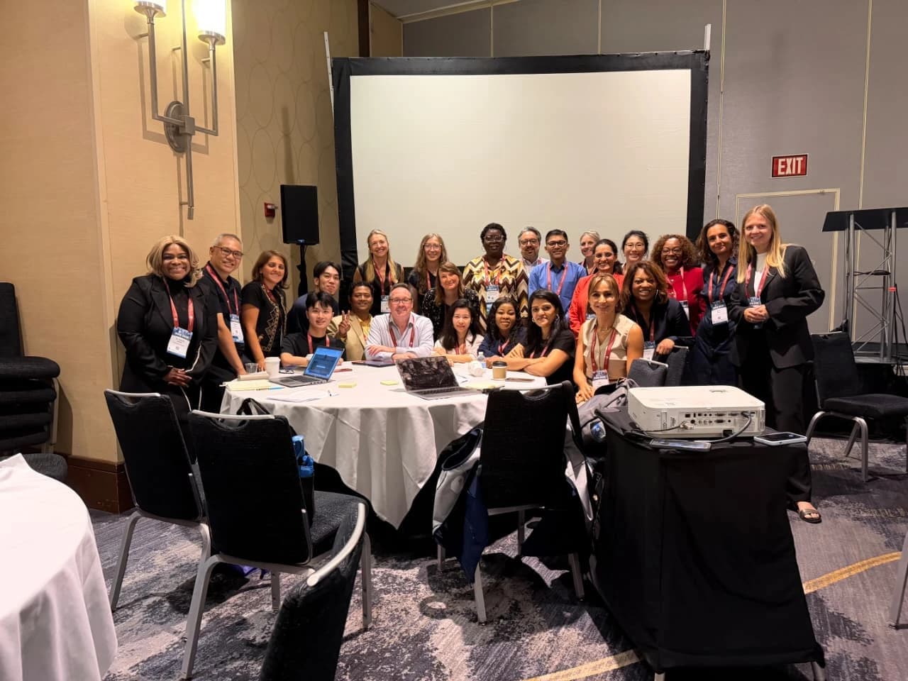 AOM 2026 participants gathered around a conference table after the Global Scholar Development session