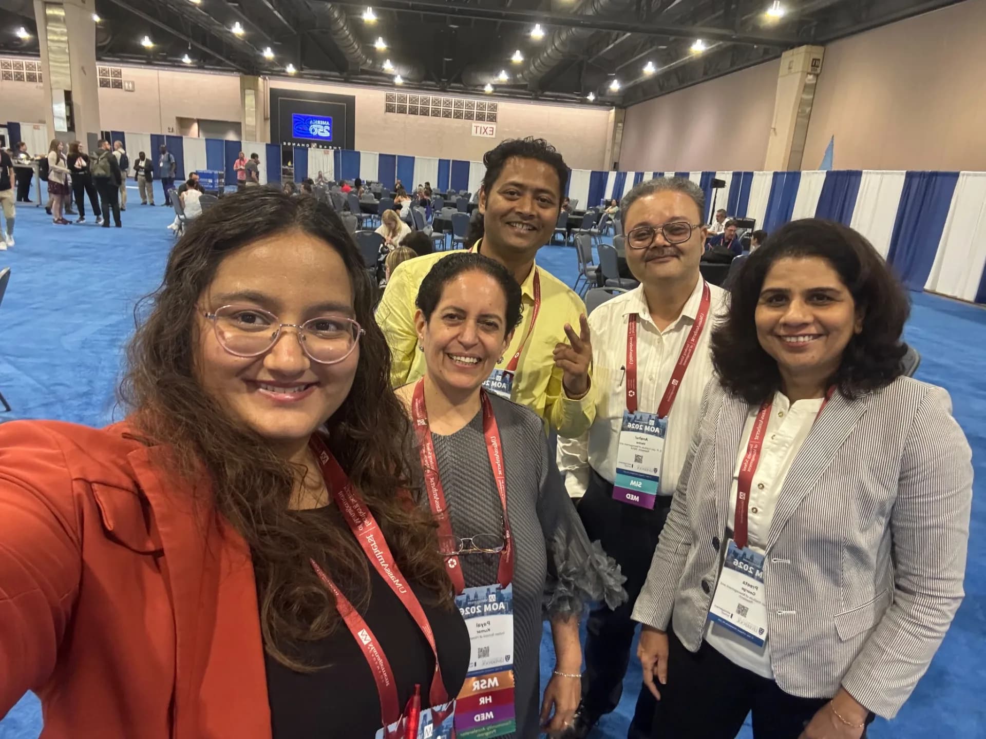 Swapnil Sahoo with four fellow Academy of Management attendees at AOM 2026 in the Philadelphia Convention Center