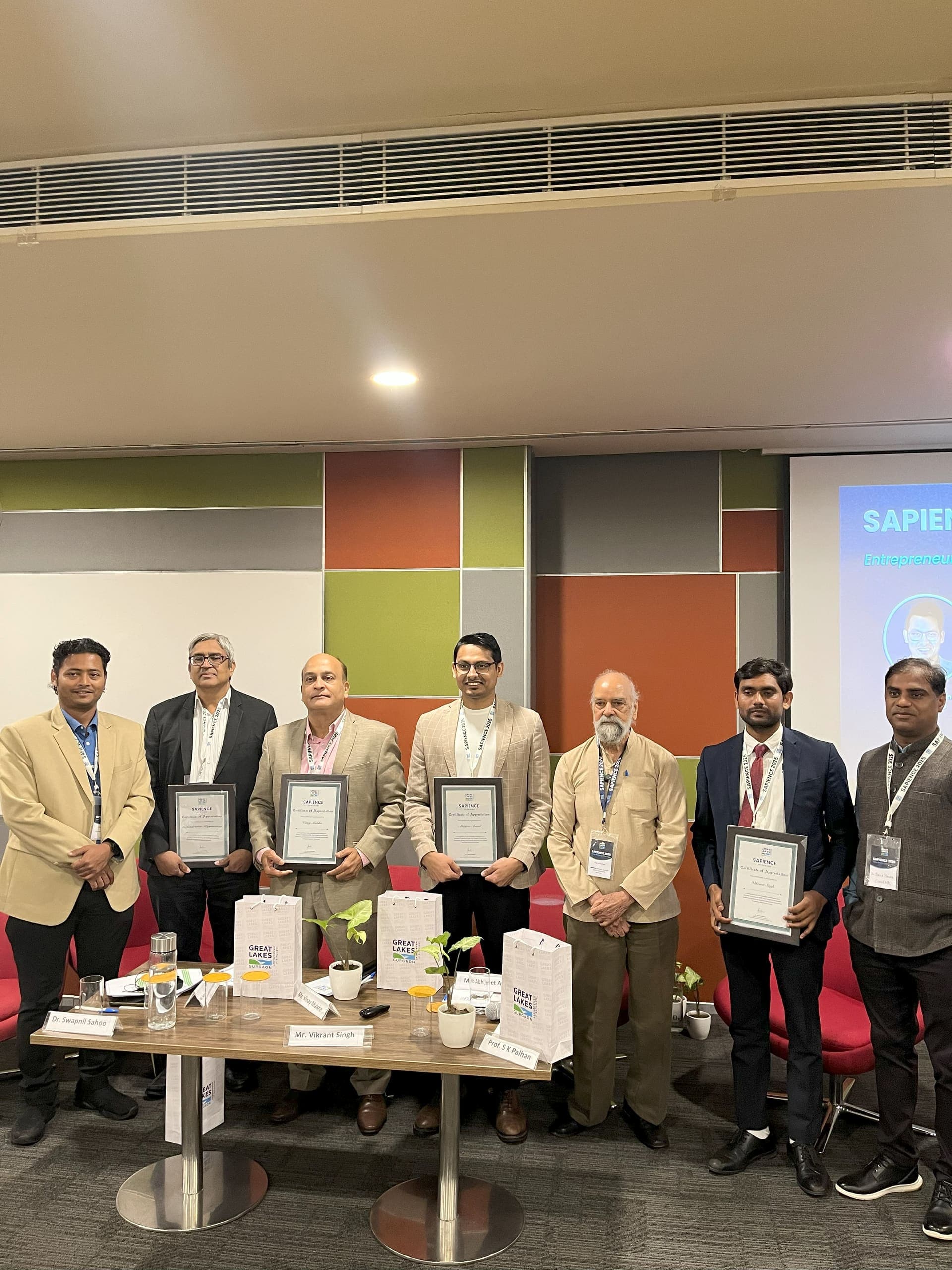 Dr Swapnil Sahoo and fellow panellists holding SAPIENCE 2025 certificates of appreciation on stage