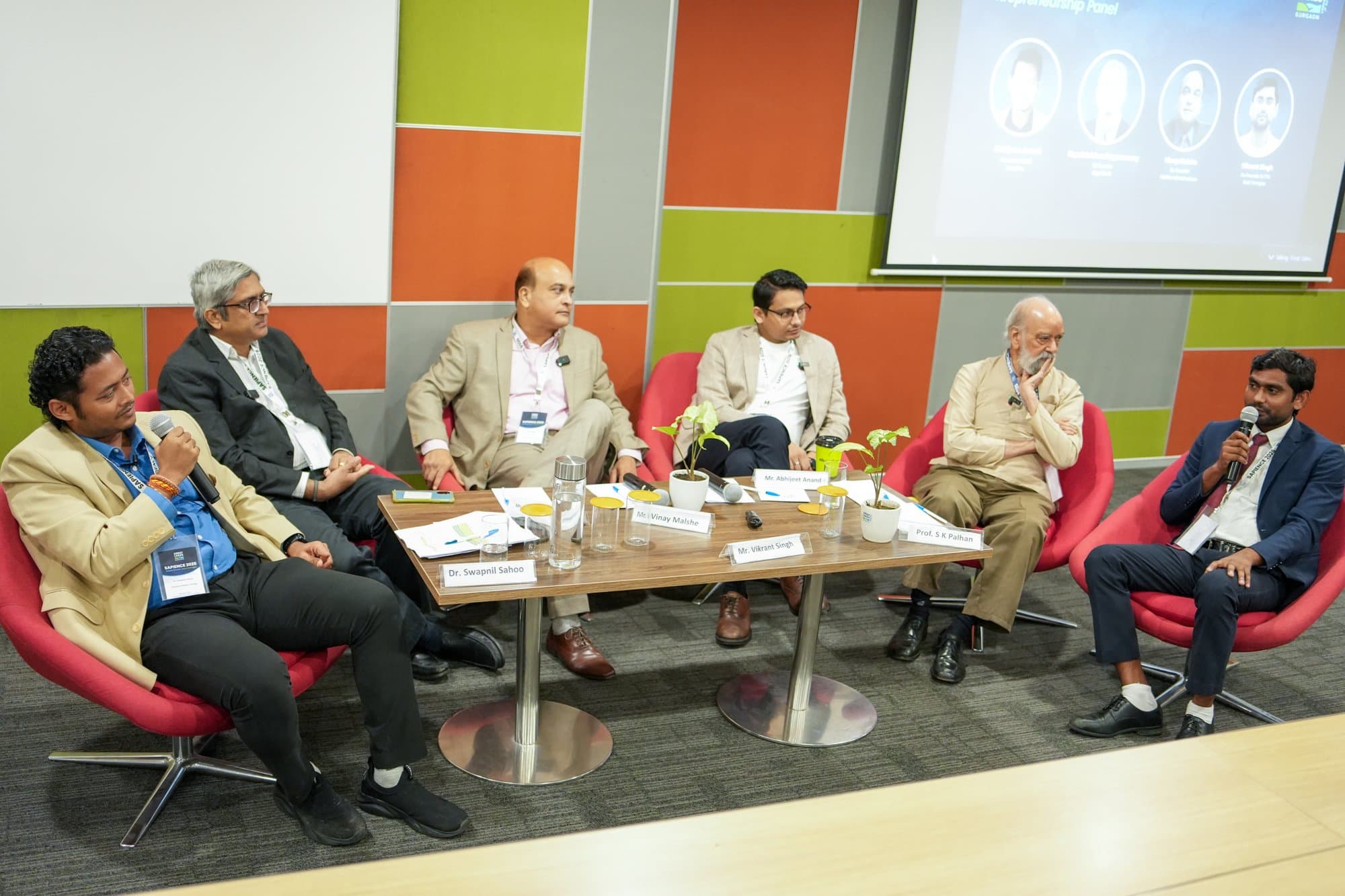 Dr Swapnil Sahoo mid-speech on a panel at SAPIENCE 2025, Great Lakes Gurgaon
